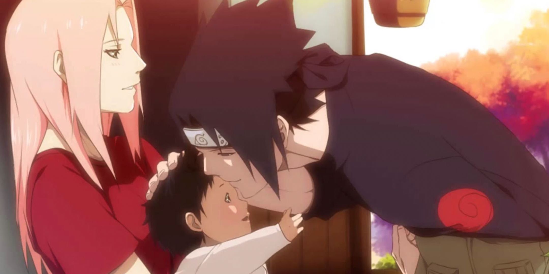 Sakura holds a baby Sarada while Sasuke leans down to her in a Boruto flashback