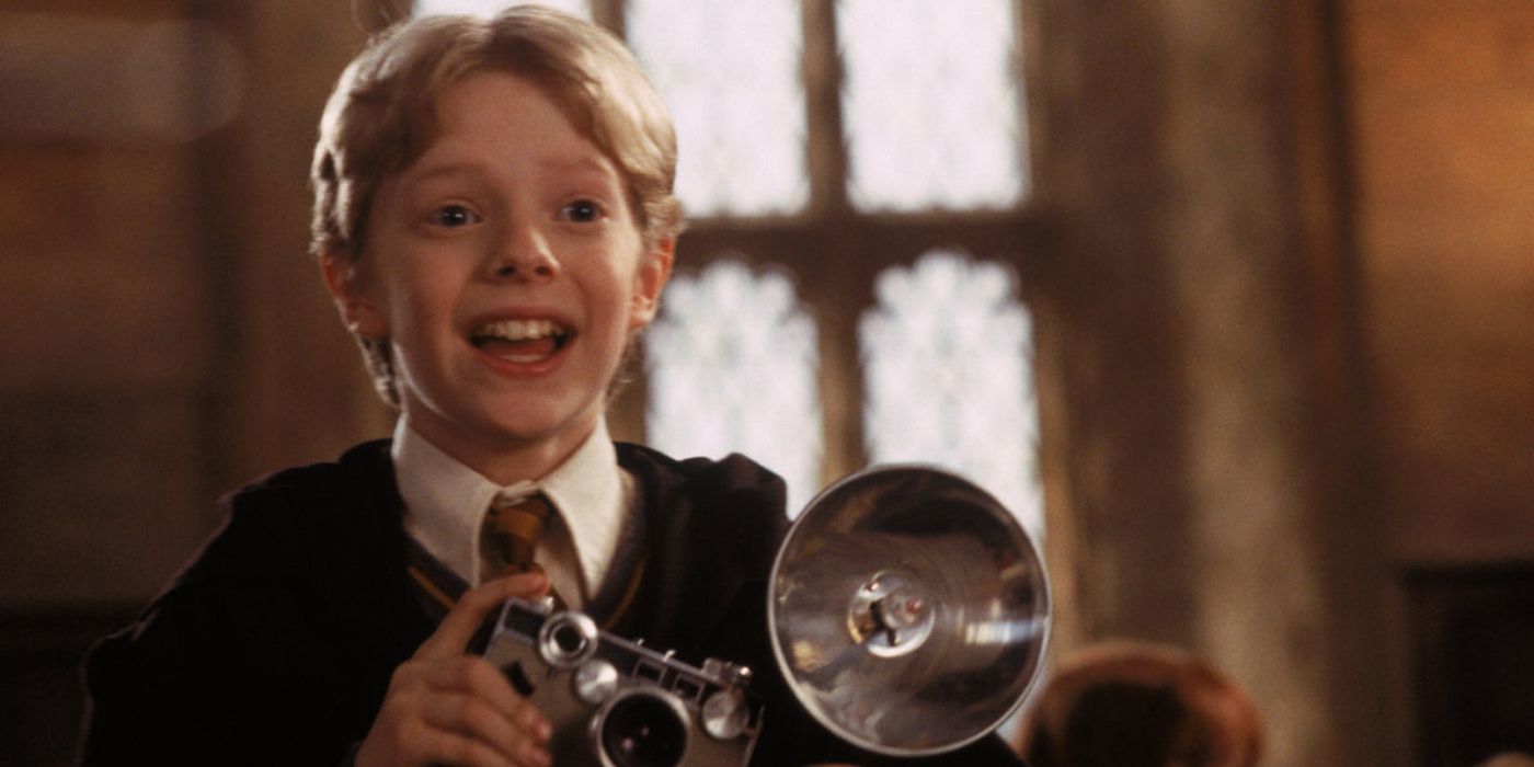 Colin Creevey taking a picture of Harry Potter