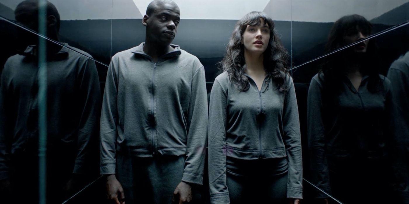 Two people in a small hall in Black Mirror