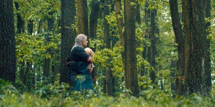 Man hugging girl in a forest