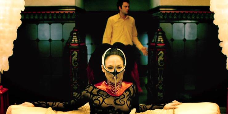 Mind-Bending Thrillers That Give You A More Painful Headache Than Interstellar 4 Vince Vaughn standing behind Jennifer Lopez wearing a starnge mask in The Cell.jpg?q=50&fit=crop&w=740&h=370&dpr=1