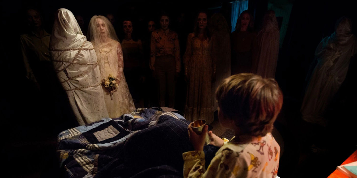 Insidious Chapter 2 Child on Bed Surrounded by Ghosts