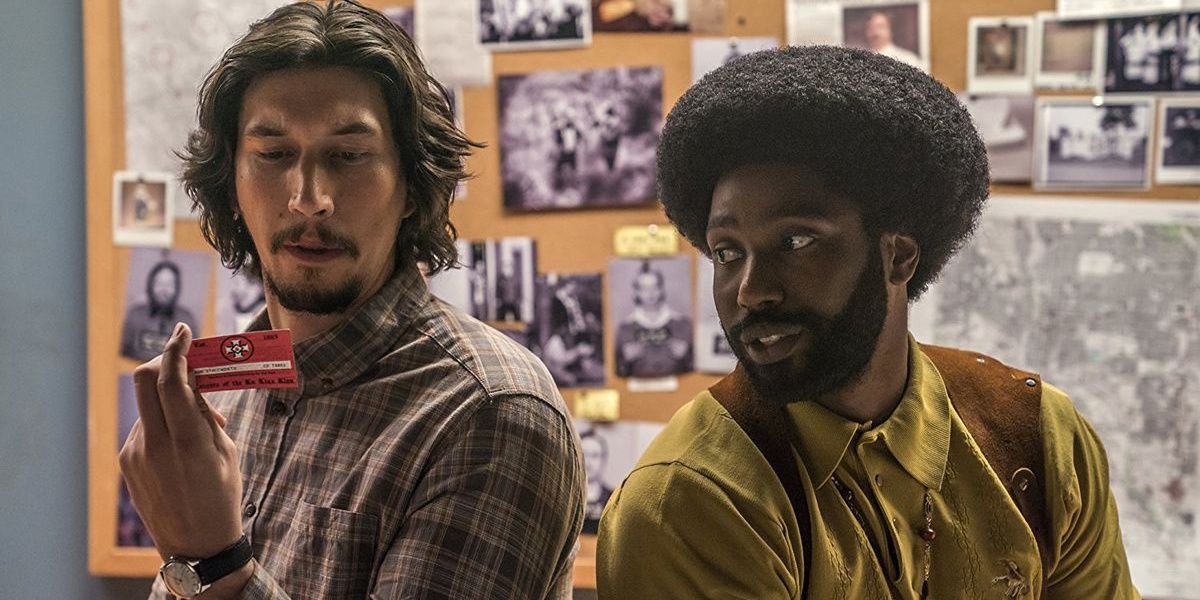 Adam Driver and John David Washington interacting in BlackKklansman Cropped