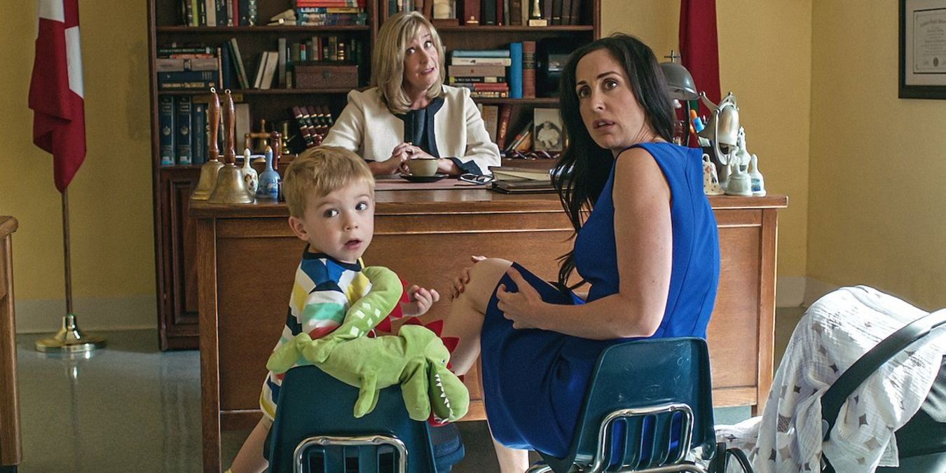 Workin Moms Kate and her son at the principals office