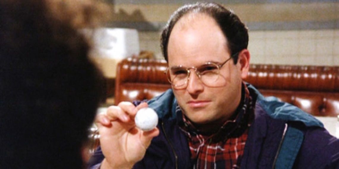 George holding a Titlist golf ball in Seinfeld