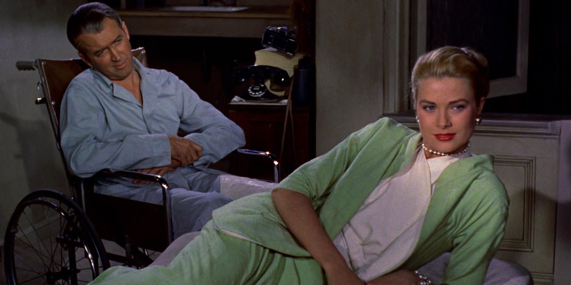 James Stewart sitting in a wheelchair with Grace Kelly lying in front of him in Rear Window