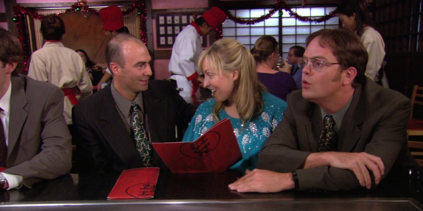 Dwight sitting next to strangers at Benihana on The Office