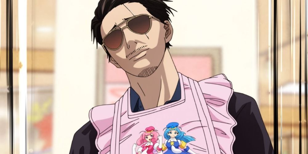 Tatsu from The Way of the House Husband wearing a pink frilly apron