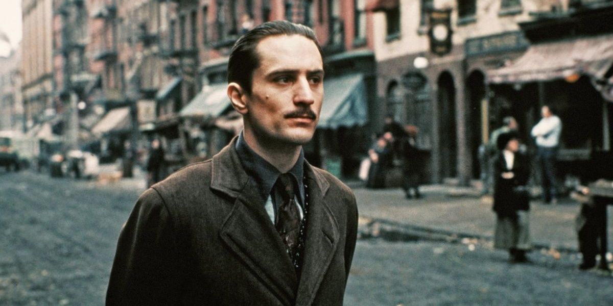 Vito Corleone walking on a street in a still from The Godfather Part II Cropped