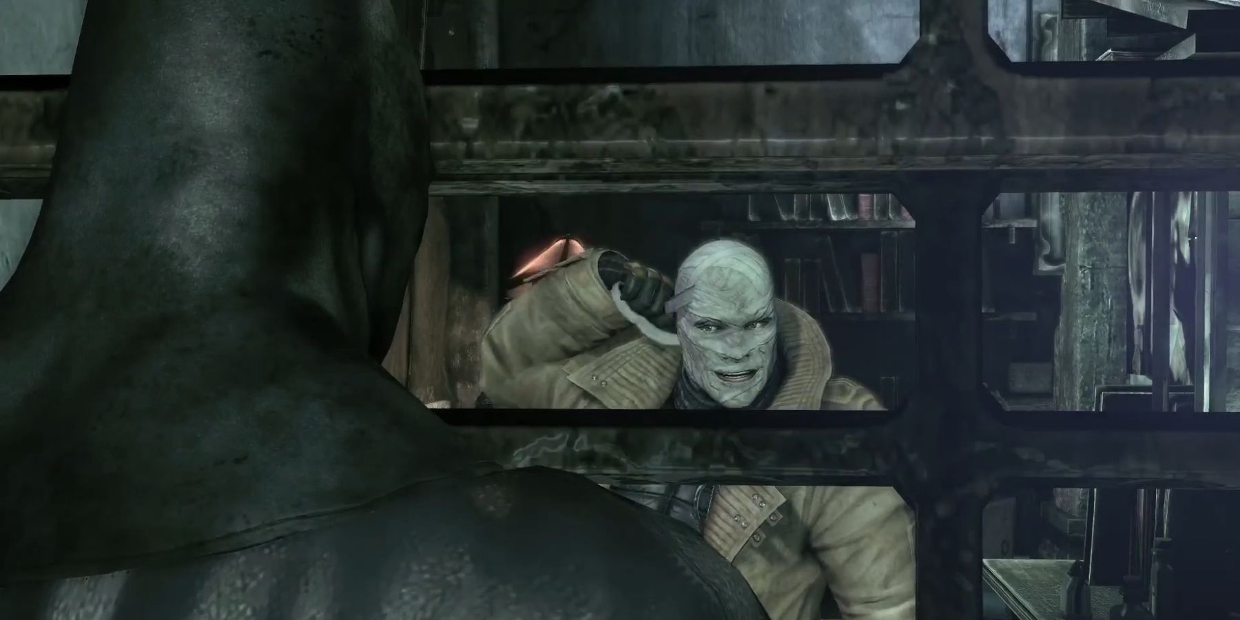 Hush unwrapping his mask in front of Batman in Batman Arkham City