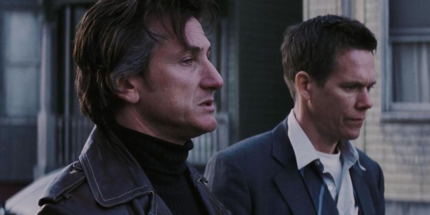 Jimmy and Sean standing together after Daves murder in Mystic River