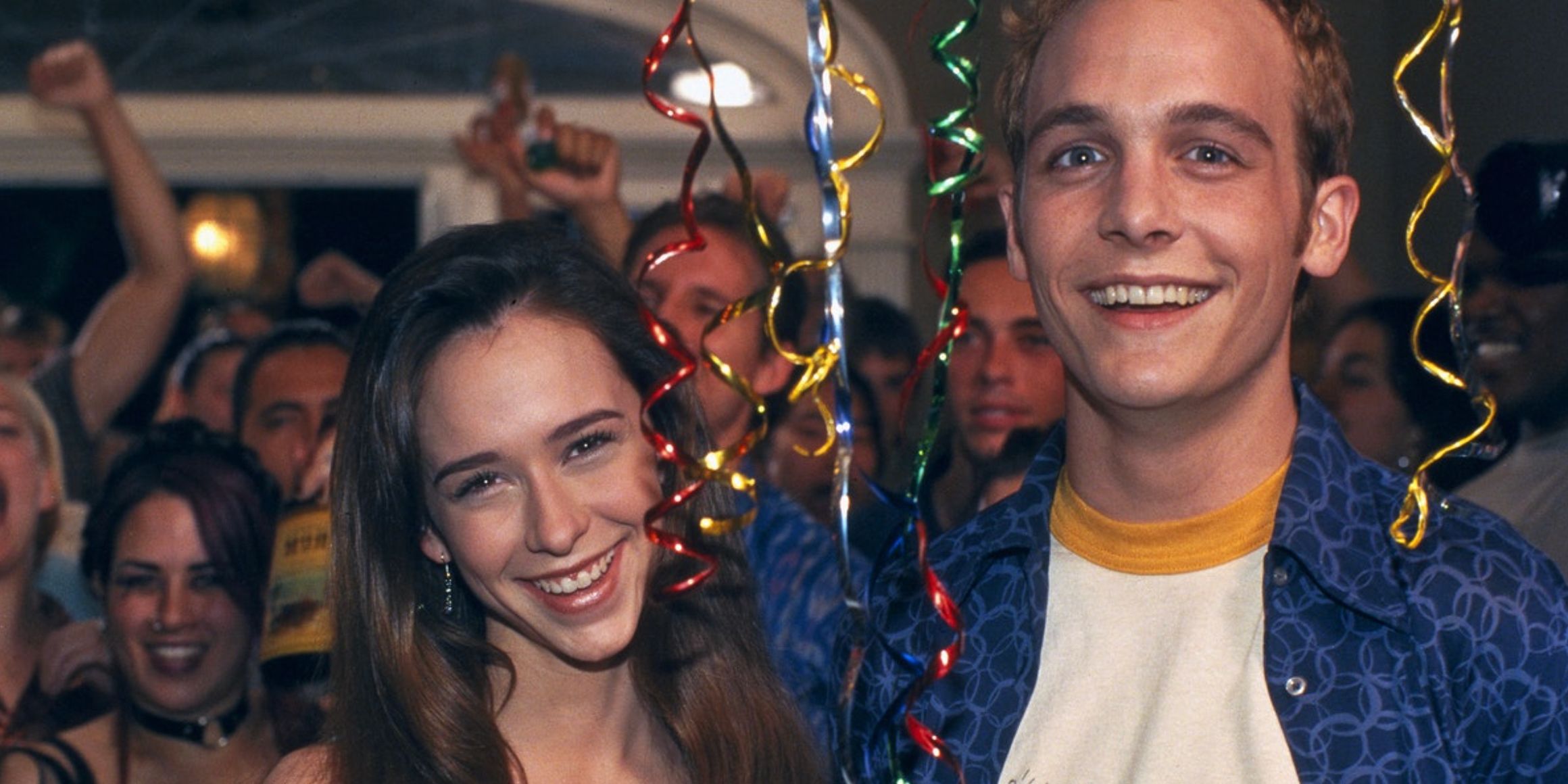 Amanda and Preston smile in the midst of a party in Cant Hardly Wait