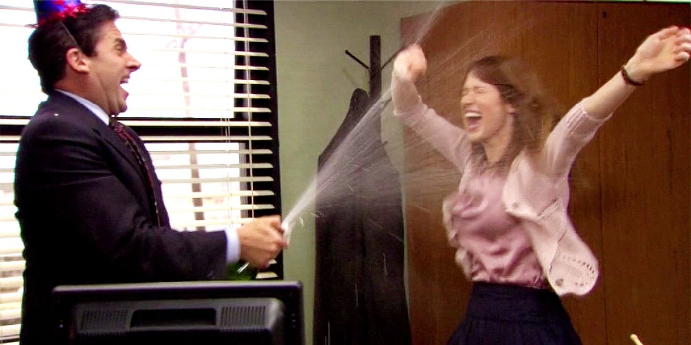Michael and Erin celebrating at Dunder Mifflin with champagne in The Office