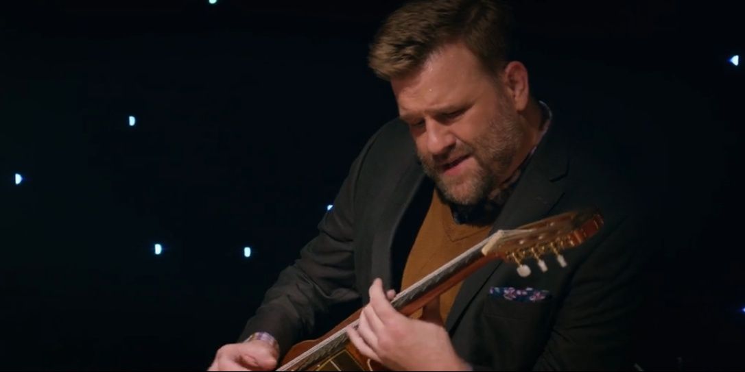 Pitts plays the guitar in Marry Me Cropped