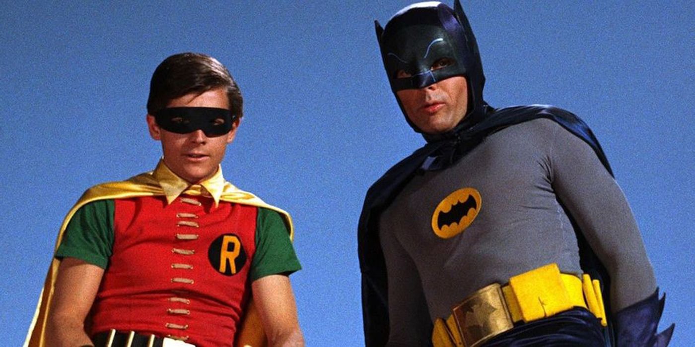 Batman and Robin standing together