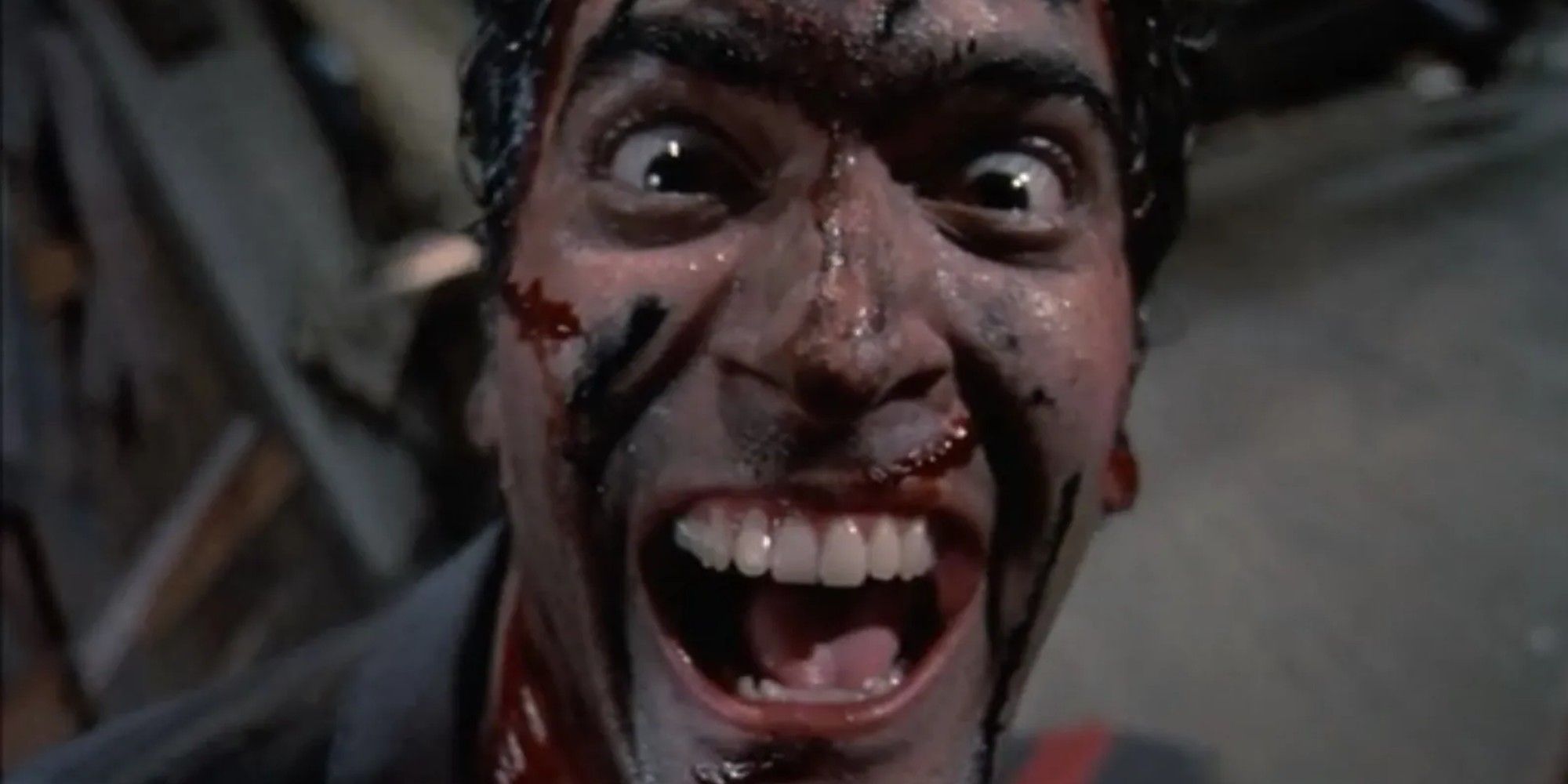 Evil Dead 2 Bruce Campbell as Ash Williams bloody and laughing