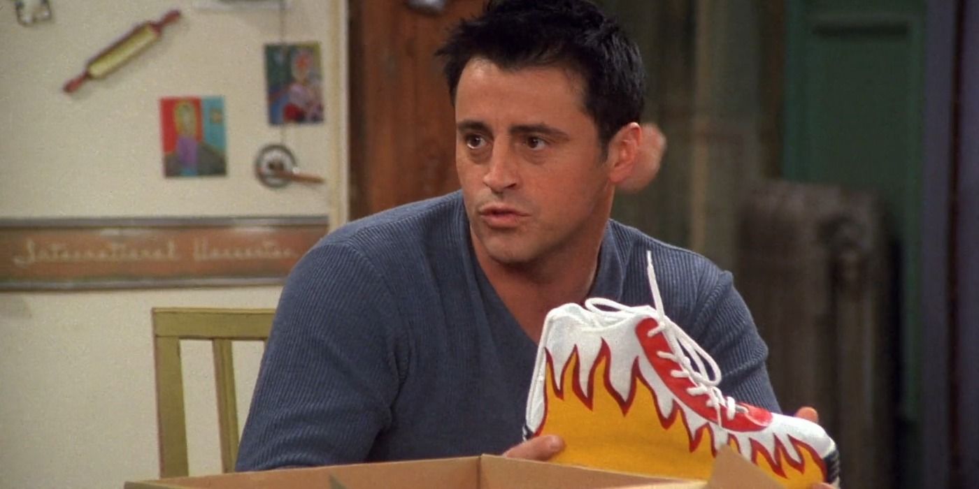 Joey Holding Chandlers Sneakers