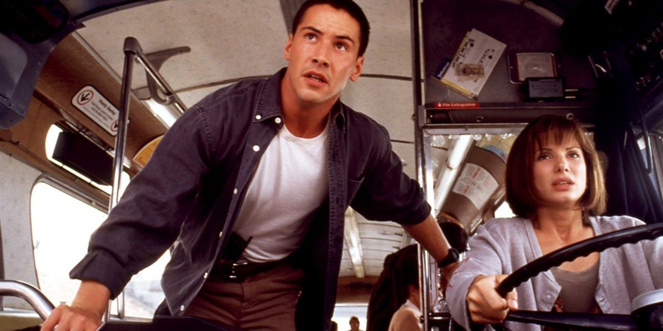 Sandra Bullock and Keanu Reeves driving a bus in Speed Cropped