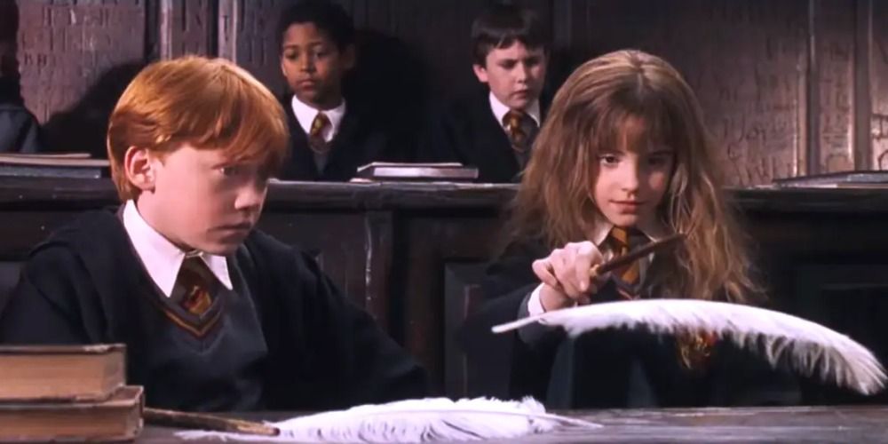 An image of Ron and Hermione sitting together in Charms class in Harry Potter