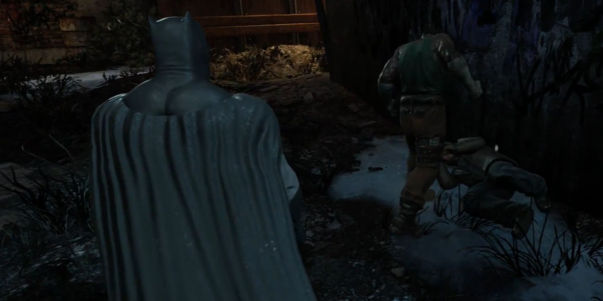 Batman sneaking up on a mugger in Batman Arkham City
