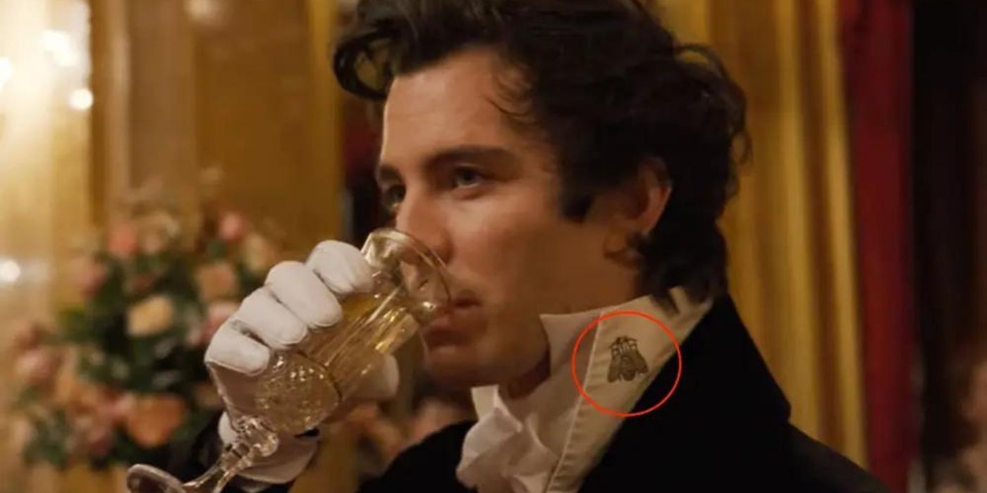 Benedict Drinking champagne with a bee on his collar on Bridgerton