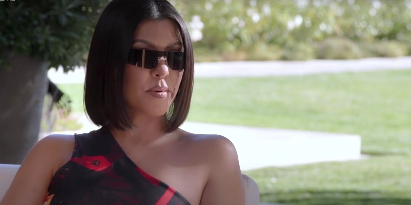Kourtney Kardashians without Hulu logo black sunglasses black dress CROPPED