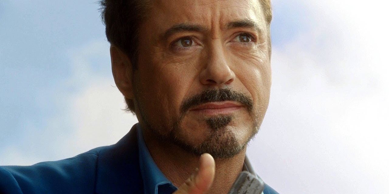 Tony Stark holds arc reactor and looks up in Iron Man 3 Cropped